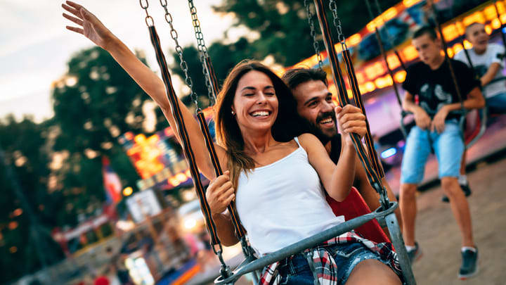 Young couple on a ride at Coney Island, New York